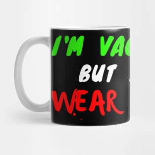 I'm vaccinated but I still wear a mask - green white and red text Mug